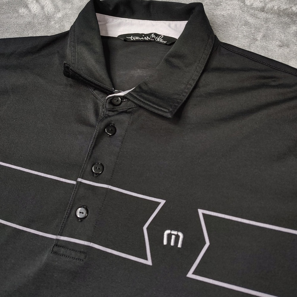 TravisMathew Black Polo with White Trim